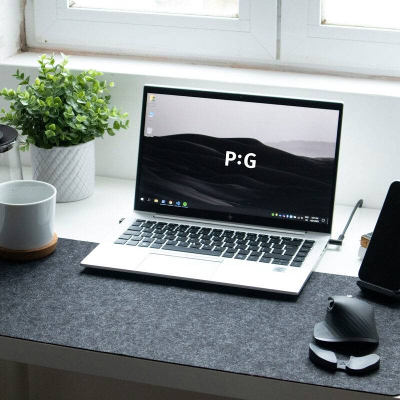 macbook pro on black table