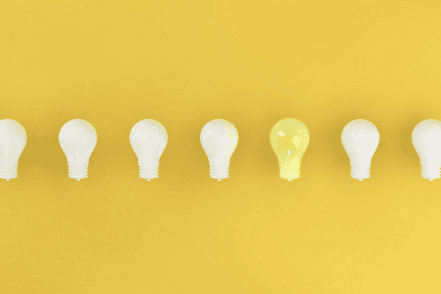 high concept marketing image of light bulbs in a row representing ideas